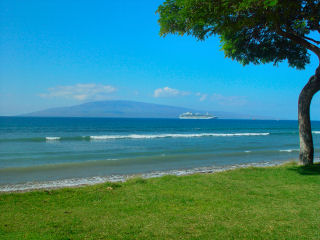 Paumana Beach, Western Coast of Maui, Hawaii.  Cruise ship in Auau Channel with island of Lanai in background.